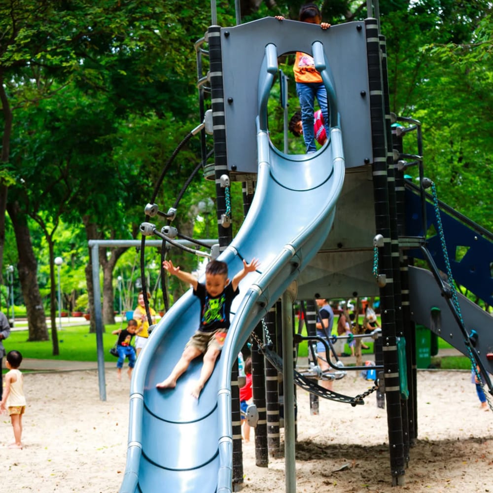 Children playing on our playground slide at The Lyle in Fort Walton Beach, Florida