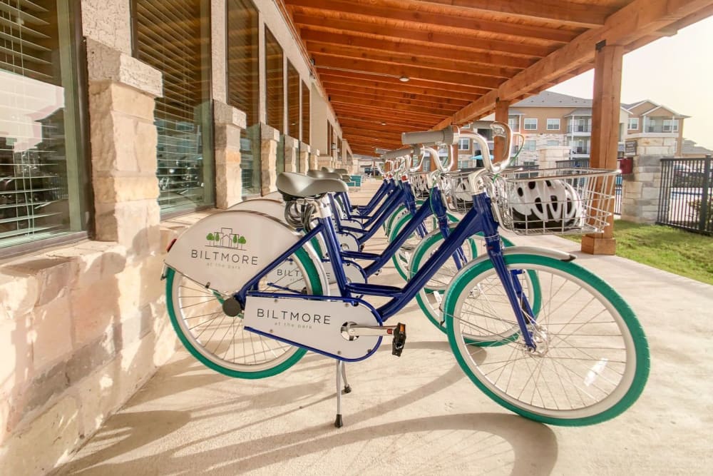 Row of community bicycle station at Biltmore at the Park in Pflugerville, Texas