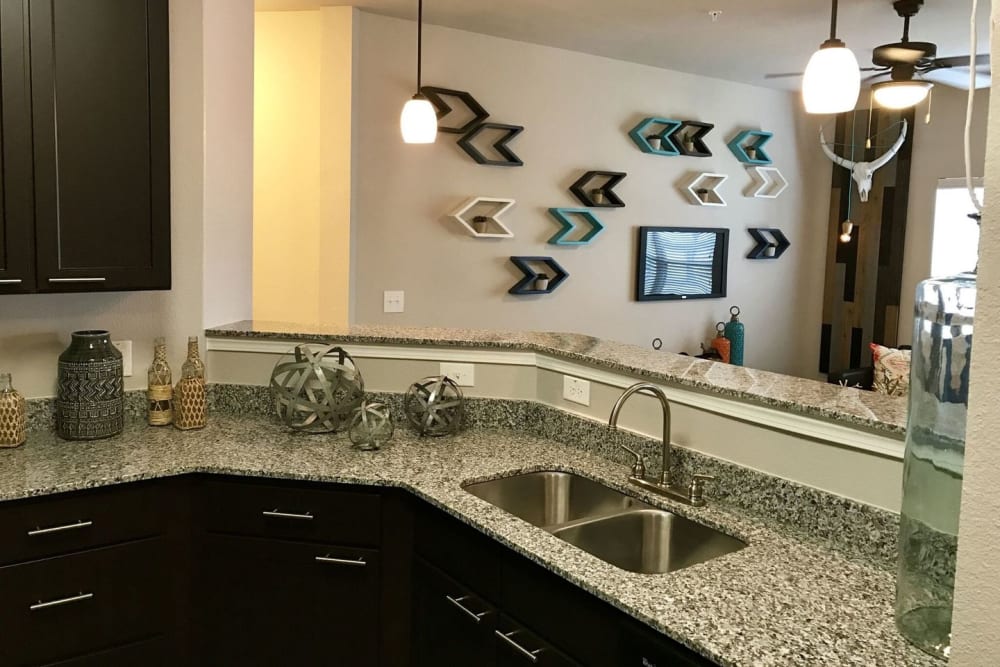View of the living room from a model kitchen at Creekside at Kenney's Fort in Round Rock, Texas