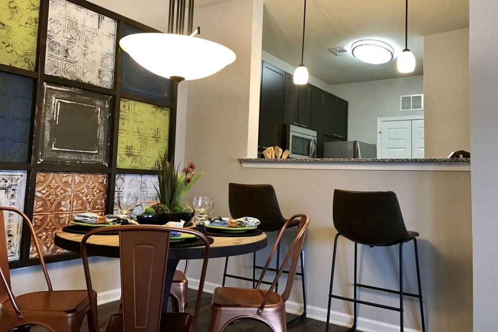 Model kitchen overlooking the dining area at Creekside at Kenney's Fort in Round Rock, Texas