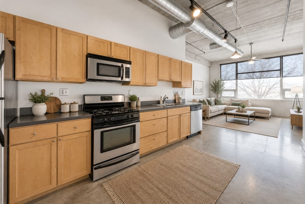Modern kitchen with stainless steel appliances at Gateway Lofts in Des Moines, Iowa
