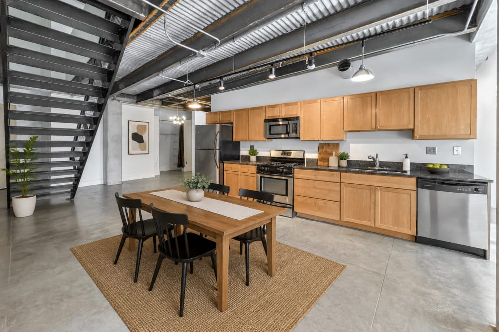 Modern kitchen with stainless steel appliances at Gateway Lofts in Des Moines, Iowa