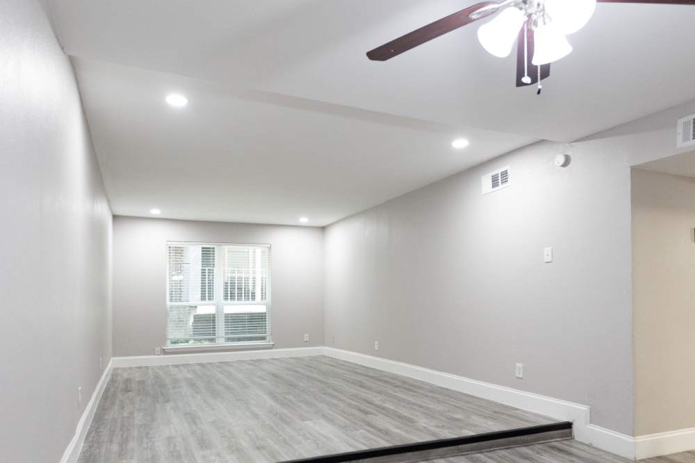 Spacious and inviting living area with modern finishes and abundant natural light at San Mateo Forest in Dallas, Texas.