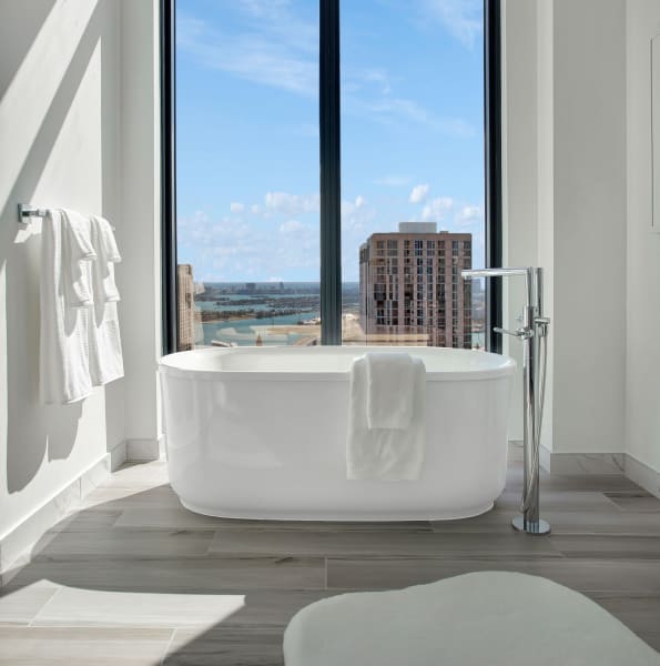 Beautiful bathtub and large windows in a bathroom at ParkLine Miami in Miami, Florida