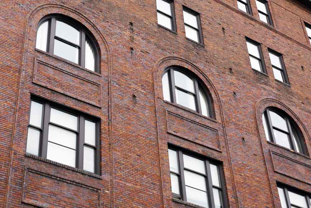 Brick wall with arched windows at Rumely Lofts in Des Moines, Iowa