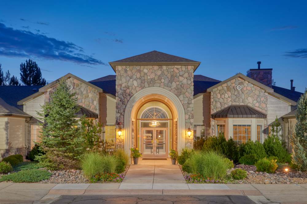 Exterior view at night of at Legend Oaks Apartments in Aurora, Colorado
