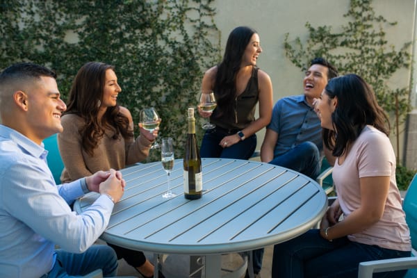 Residents getting to know each other at one of the outdoor common areas at San Cervantes in Chandler, Arizona