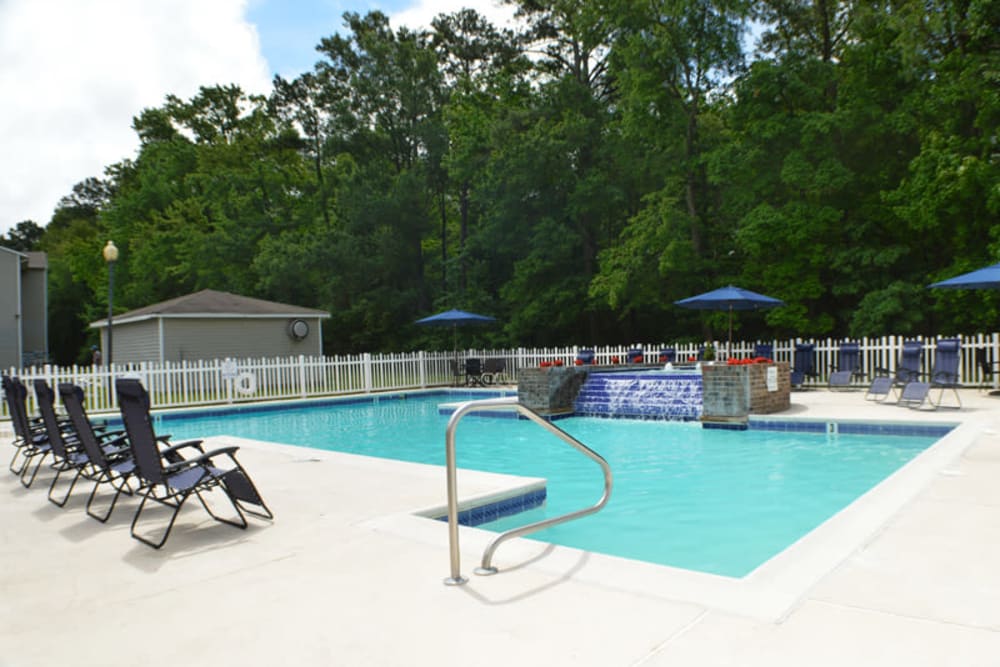 Resort-style swimming pool with a sundeck at Laurel Pines Apartments in Richmond, Virginia