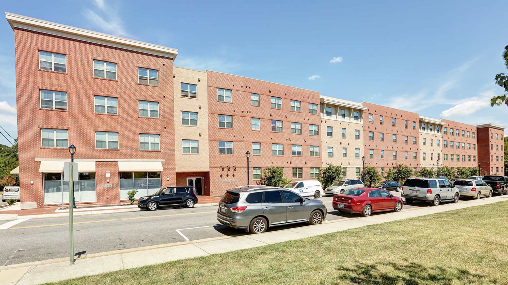 Apartment exterior shot with off street parking at Freedman Point in Hopewell, Virginia