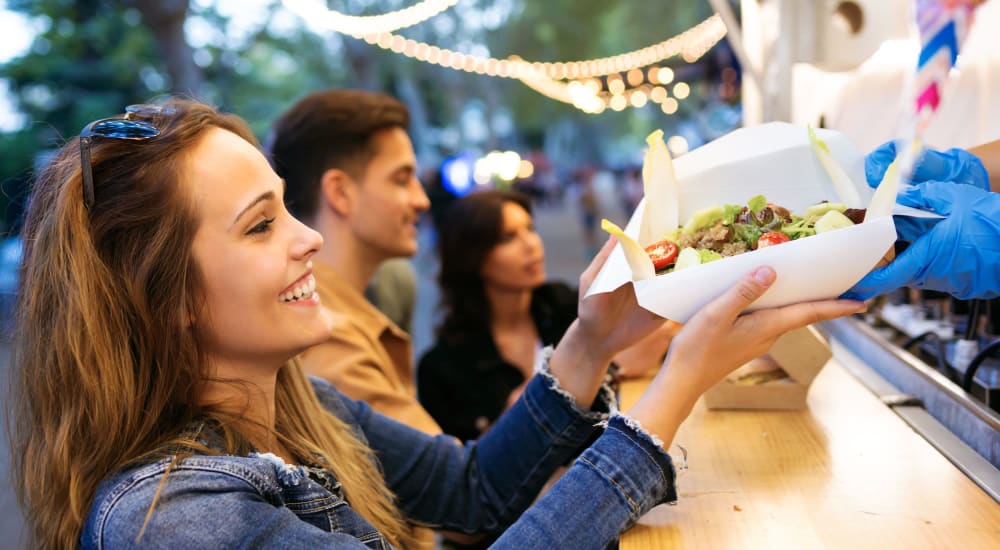 Residents grab a bite to eat from a food truck near Clinton Lake in Clinton, Pennsylvania