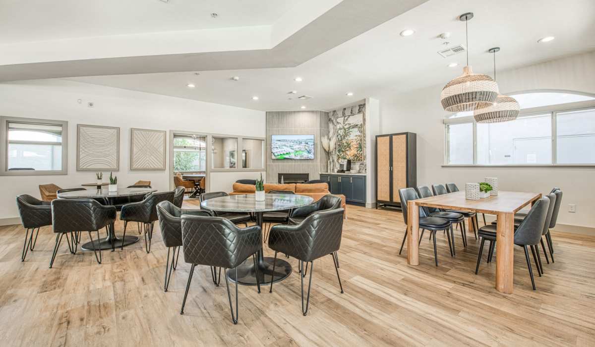 Community dinning space with multiple chairs and tables at Westwood Bluffs in Fresno, California