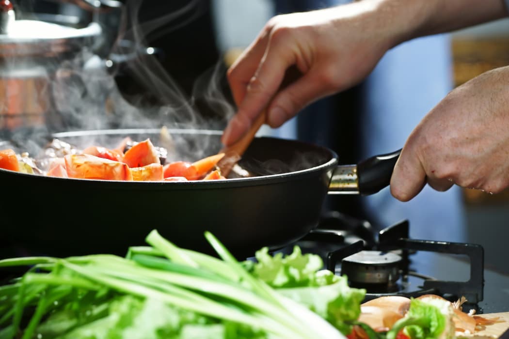 Vegetables cooking in skillet Raintree Apartments in Wichita, Kansas