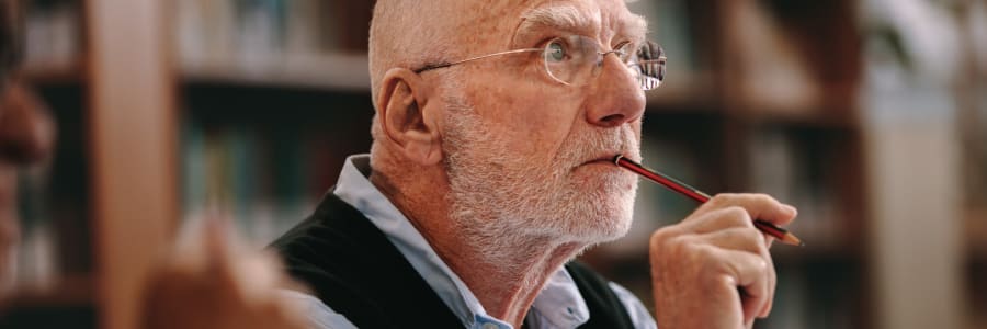 Resident contemplating an answer to a question at Transitions At Home in Elkhorn, Wisconsin