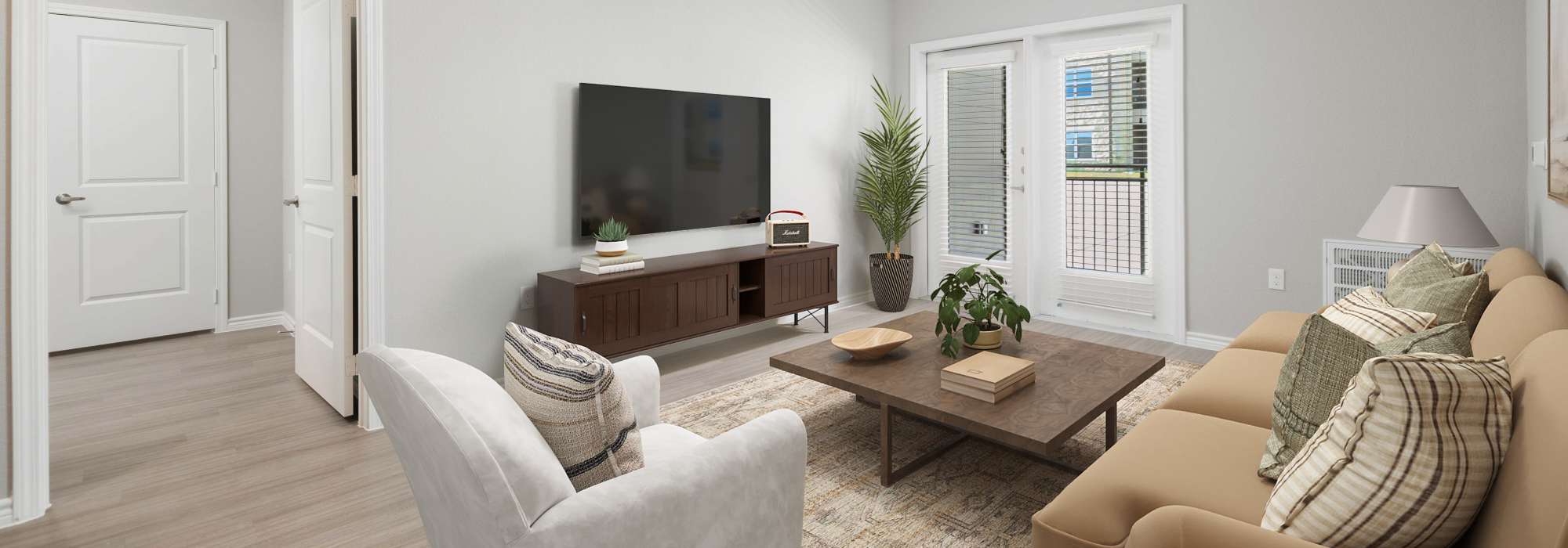 Living room with center table and television at Emerald Place in Lancaster, Ohio