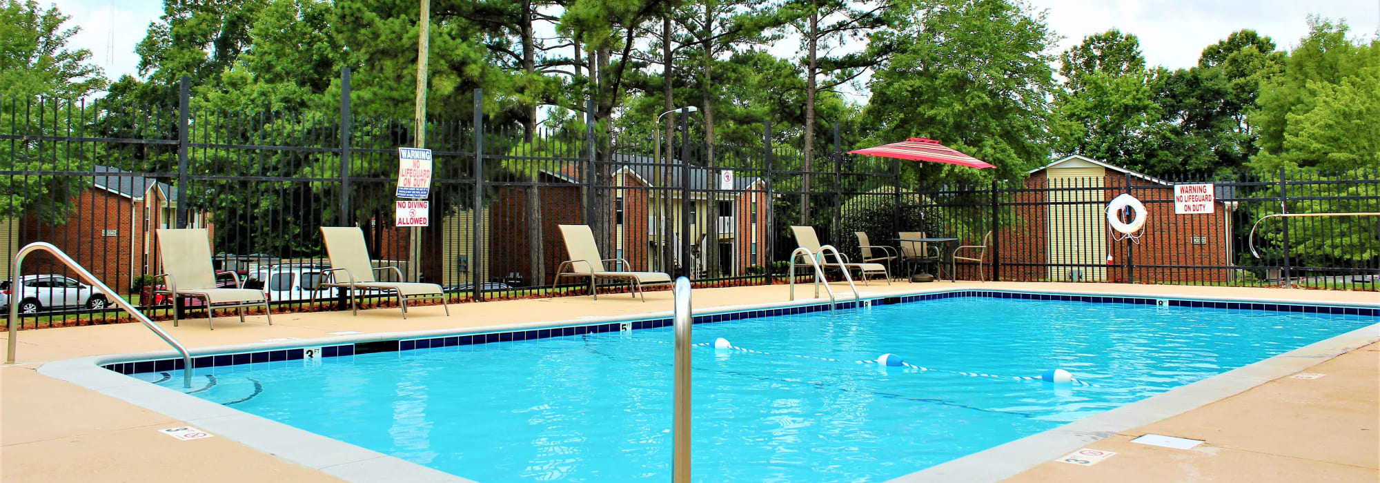 Lounge chairs by the pool at Arborgate Apartments Homes in Charlotte, North Carolina