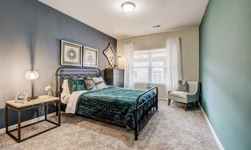 Large master bedroom with plush carpeting at Torrente Apartment Homes in Upper St Clair, Pennsylvania