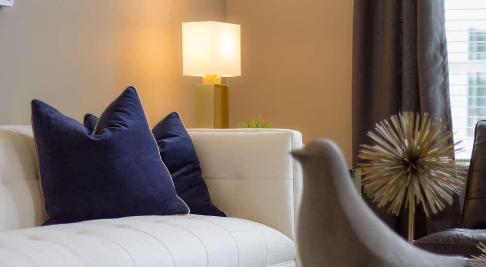 Luxurious living room with large couch at Chroma in Saint Louis, Missouri