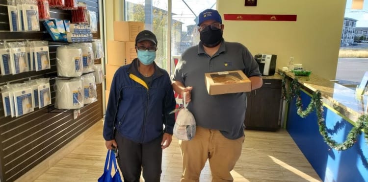 Storage Star Laredo Managers delivering Thanksgiving meals. 