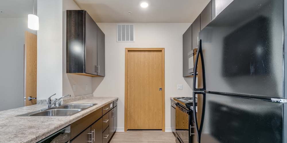 Apartment kitchen with fridge at Eva Manor in Pleasant Prairie, Wisconsin