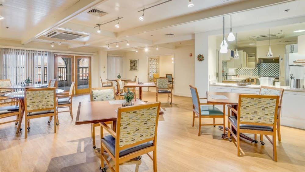 Brightly lit dining hall with seating at Oxford Vista Wichita in Wichita, Kansas