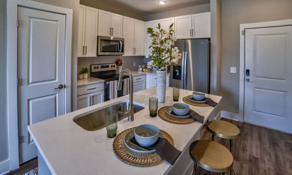 Kitchen with barstool at Avonlea Pointe in Duluth, Georgia