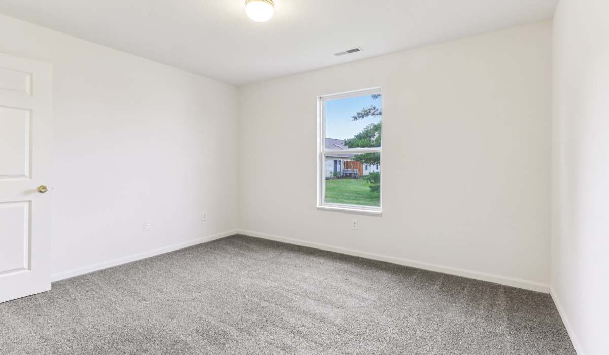Bedroom with windows at Broadway Village Apartments in Greenfield,Indiana