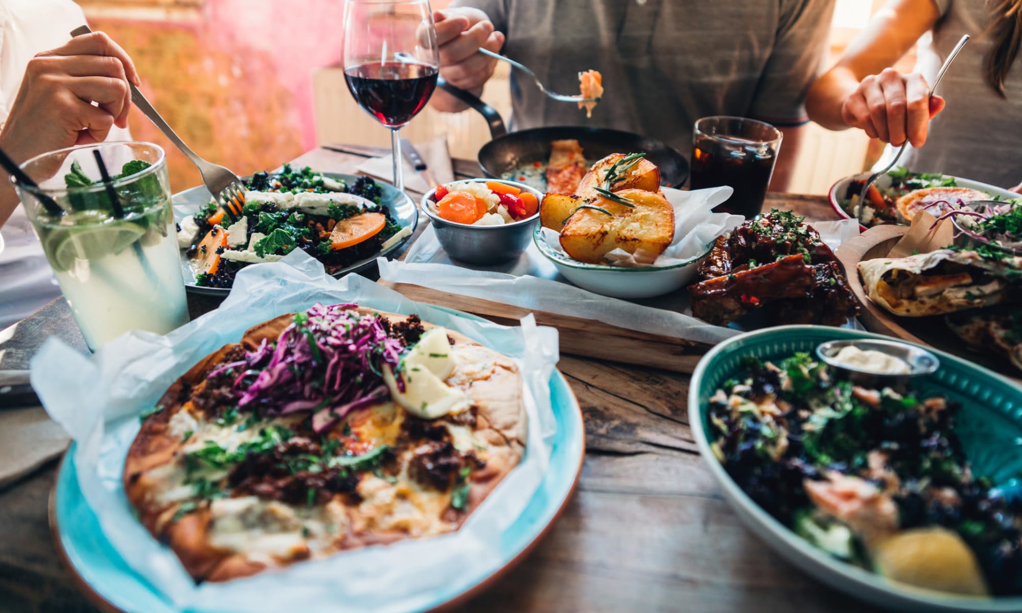 Residents about to dive into a delicious feats at their favorite restaurant near The Meadows in Culver City, California