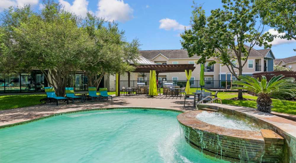 Pool with lounge beds at Residence at Lake Jackson in Lake Jackson, Texas 