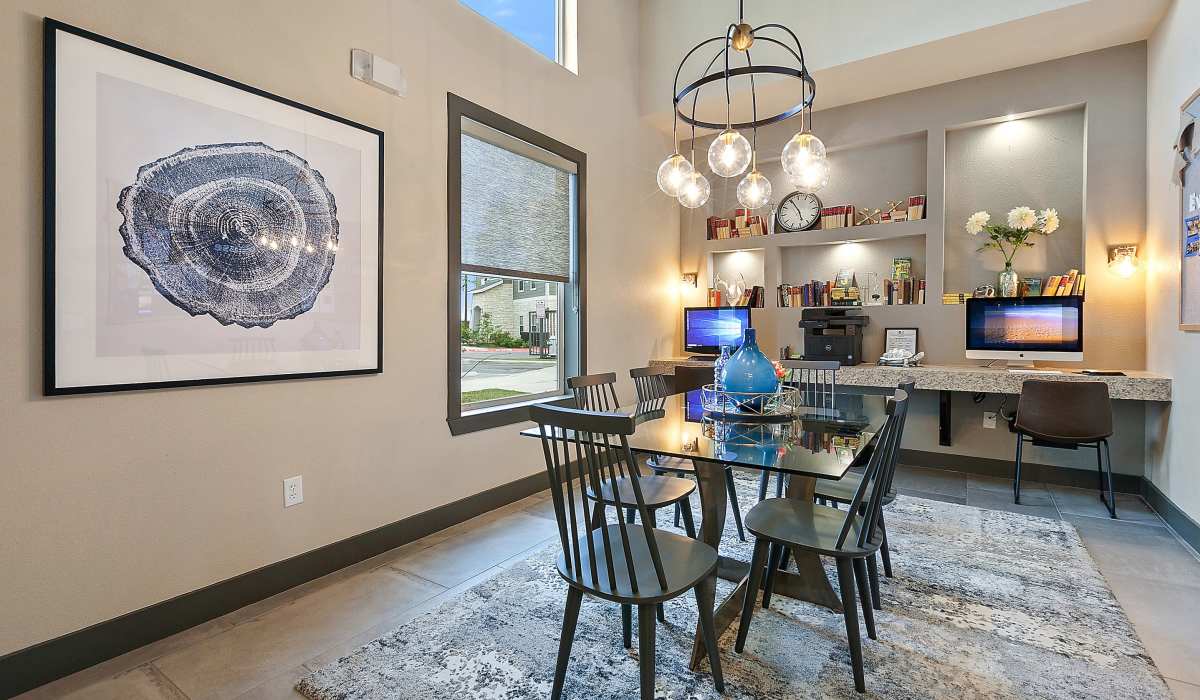 Community seating area with computer center at Canyon House in New Braunfels, Texas
