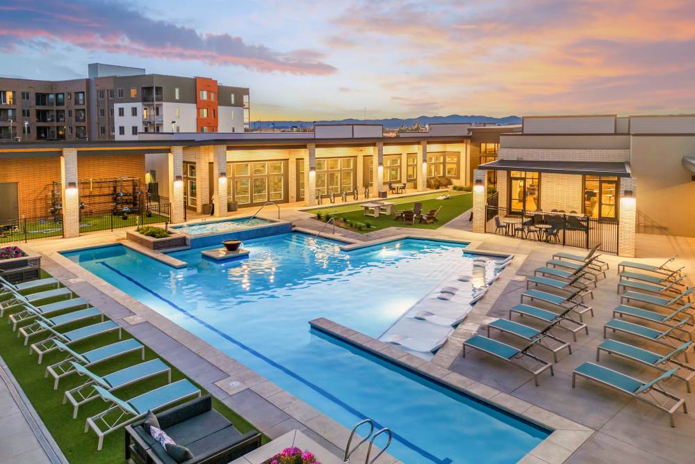 Resort type swimming pool with lounge seating  at Flats on the A in Aurora, Colorado