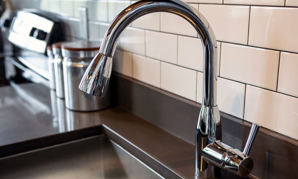 Modern features in a model home's kitchen at West Village Lofts at Brandon Mill in Greenville, South Carolina