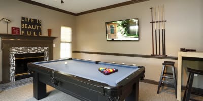 Community game room with pool table at Waterford Place in Greenville, North Carolina