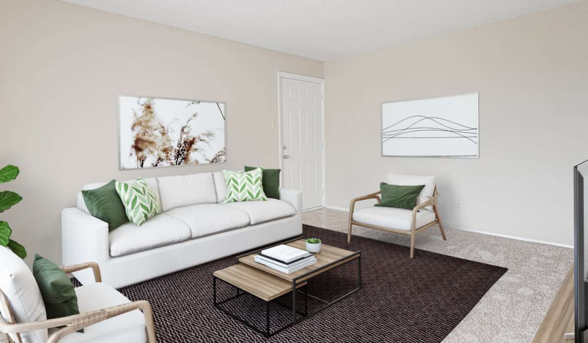 Living room with carpet flooring at Courtyard Apartments in Columbia, Missouri