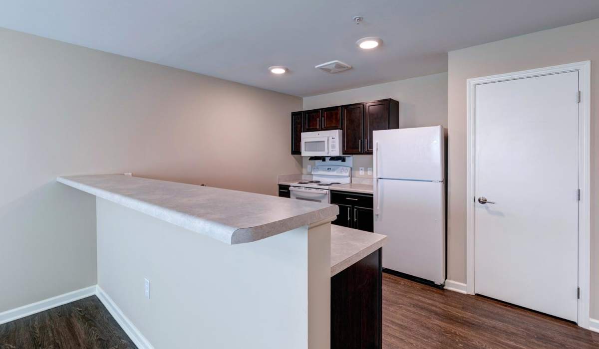 Kitchen with wood flooring at Harpers Crossing in Plainfield. IN at Harpers Crossing in Plainfield, Indiana