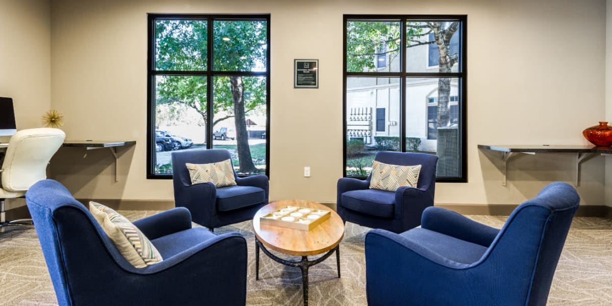 Community lounge seating area with big windows at Marquis at Barton Trails in Austin, Texas