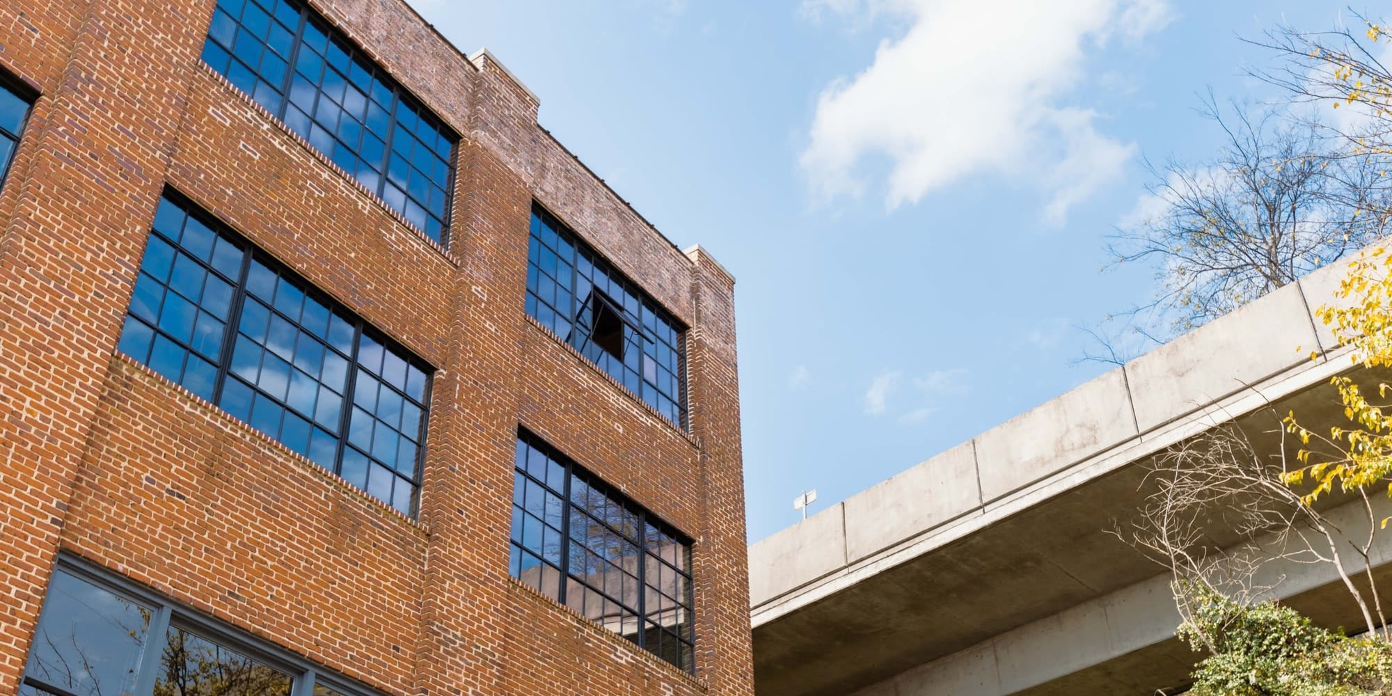 View angled upward of exterior brick building at Lofts at Abrams Fixtures in Atlanta, Georgia