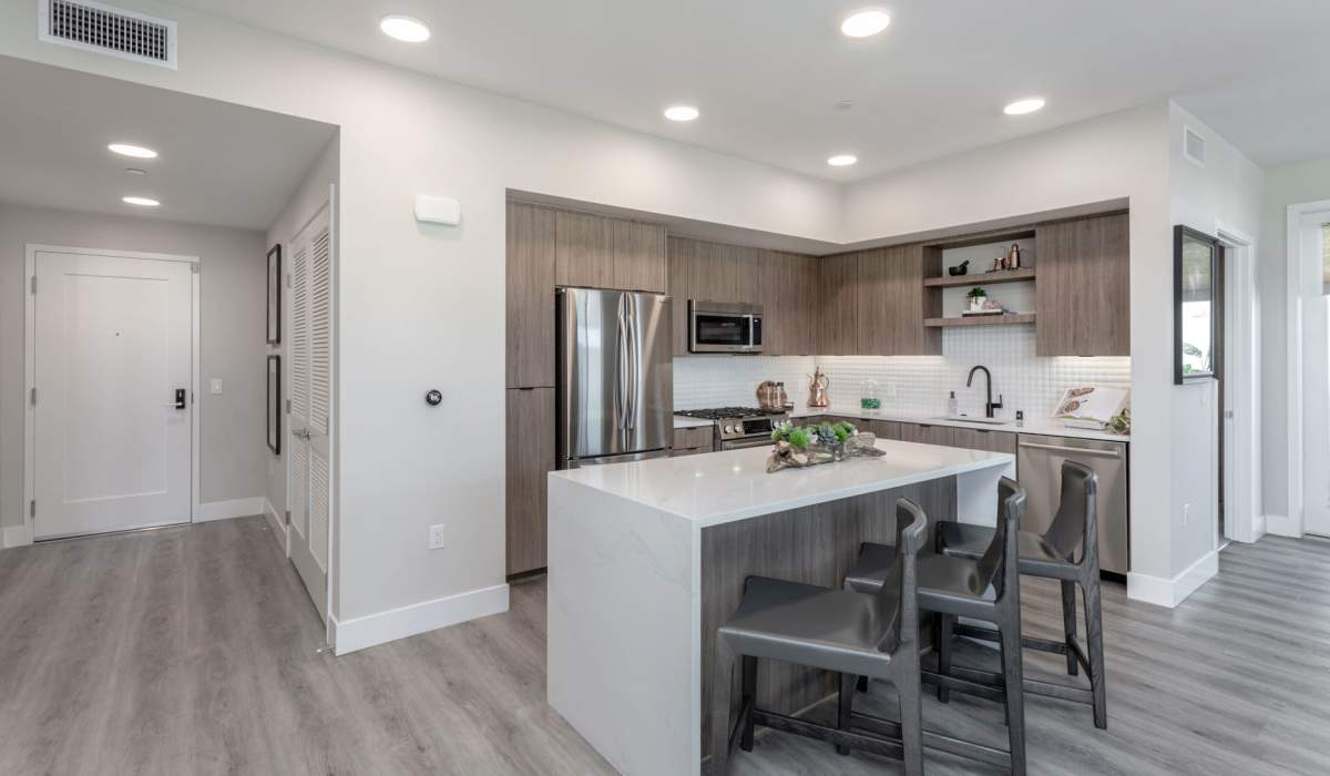 Kitchen with island and wood-style flooring at Prado West in Dana Point, California