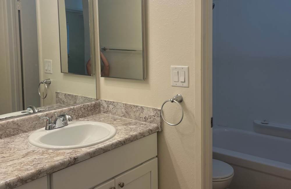 Bathroom with large vanity at  Forest Park in Chico, California