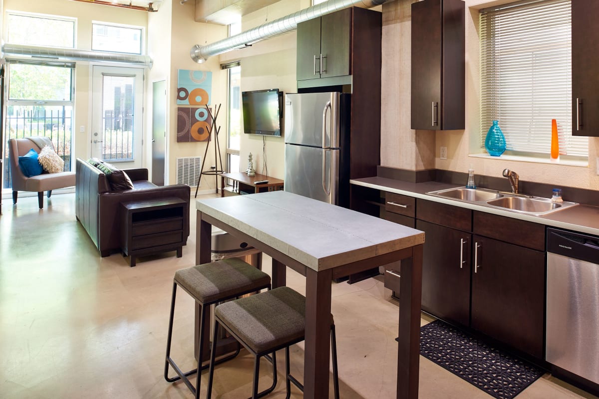 Kitchen with stainless-steel appliances and a kitchen island at Flux in Minneapolis, Minnesota
