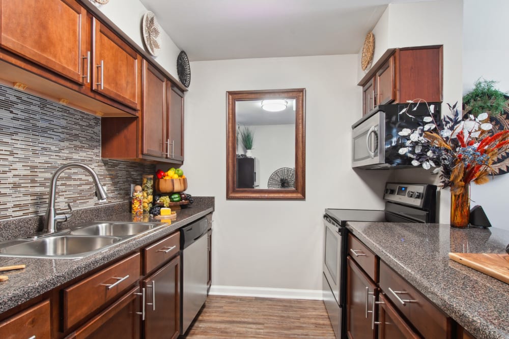 Shining kitchen area at Emerald Pointe Apartment Homes in Harvey, Louisiana