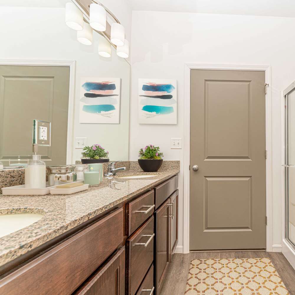 Bathroom with a large mirror Celtic Crossing in St. Peters, Missouri