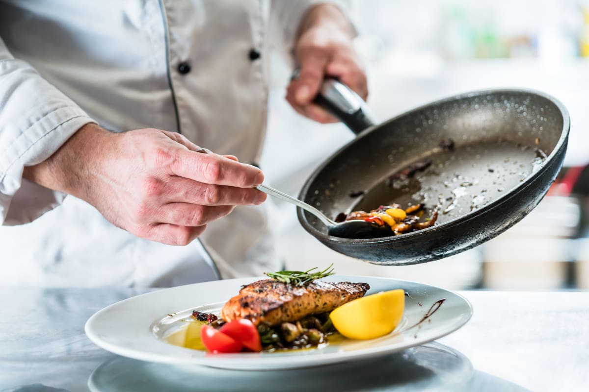 Chef plating a meal at Gentry Park Orlando in Orlando, Florida