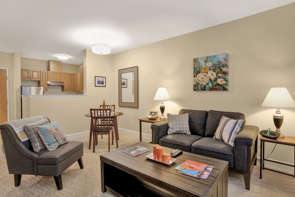 Resident apartment living room with furnishings at The Creekside in Woodinville, Washington