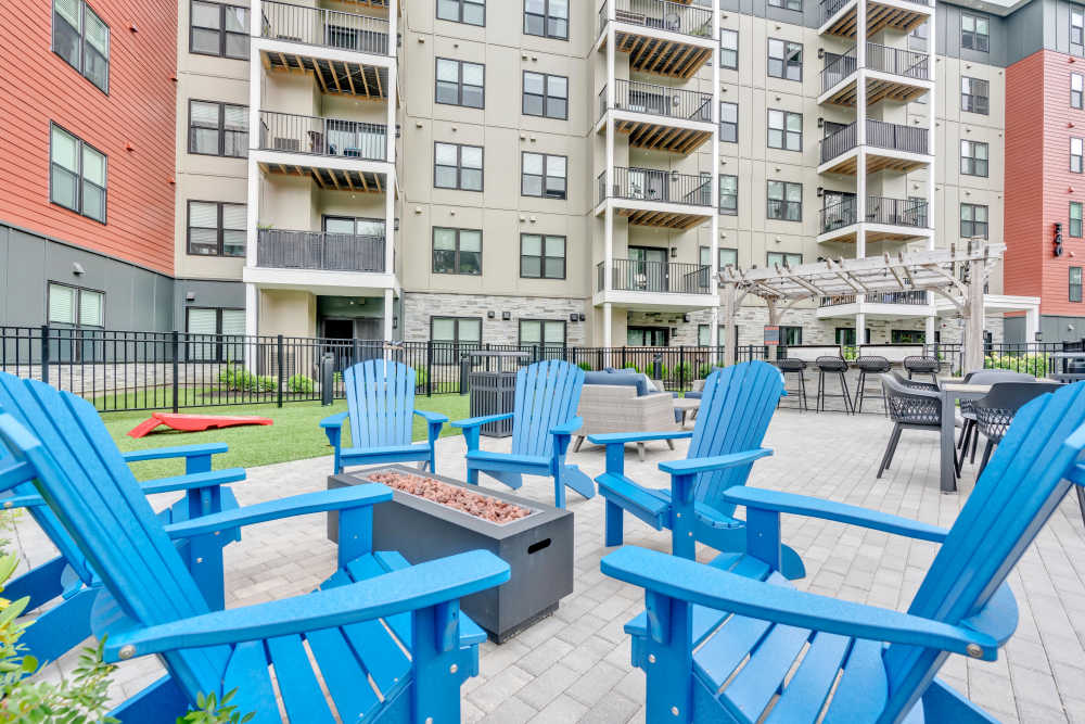 Apartment building with balconies and seating area at Latitude at South Portland in Portland, Maine