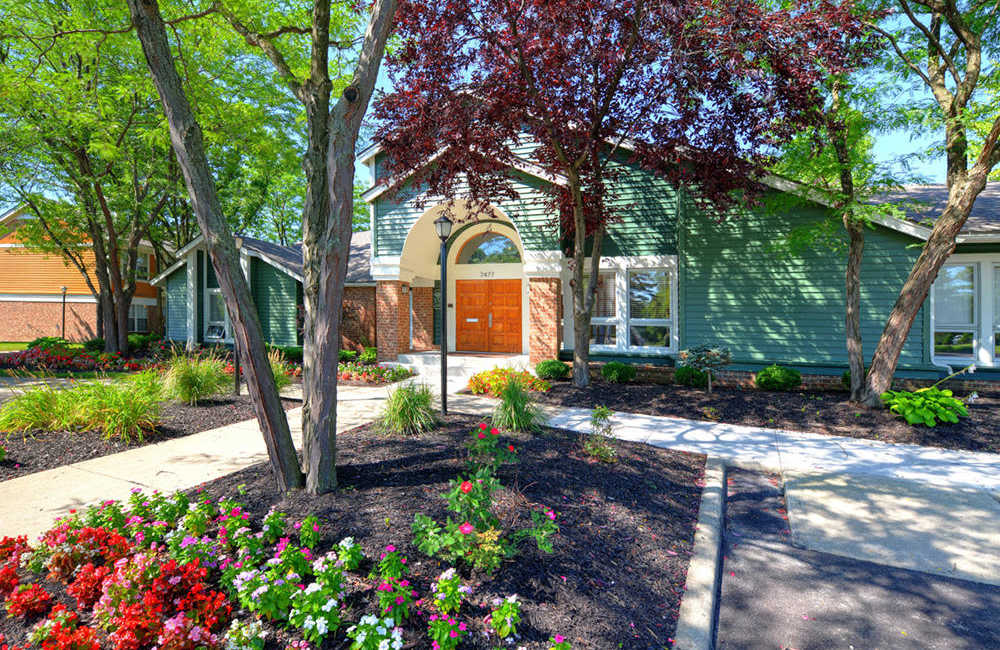 Flowers outside the leasing center of Mad River Apartment Homes in Dayton, Ohio
