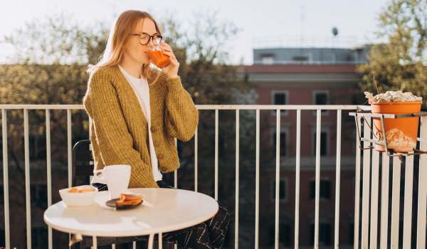 Resident in her balcony enjoying her coffee and sunrise at The Bayou District in Gulfport, Mississippi
