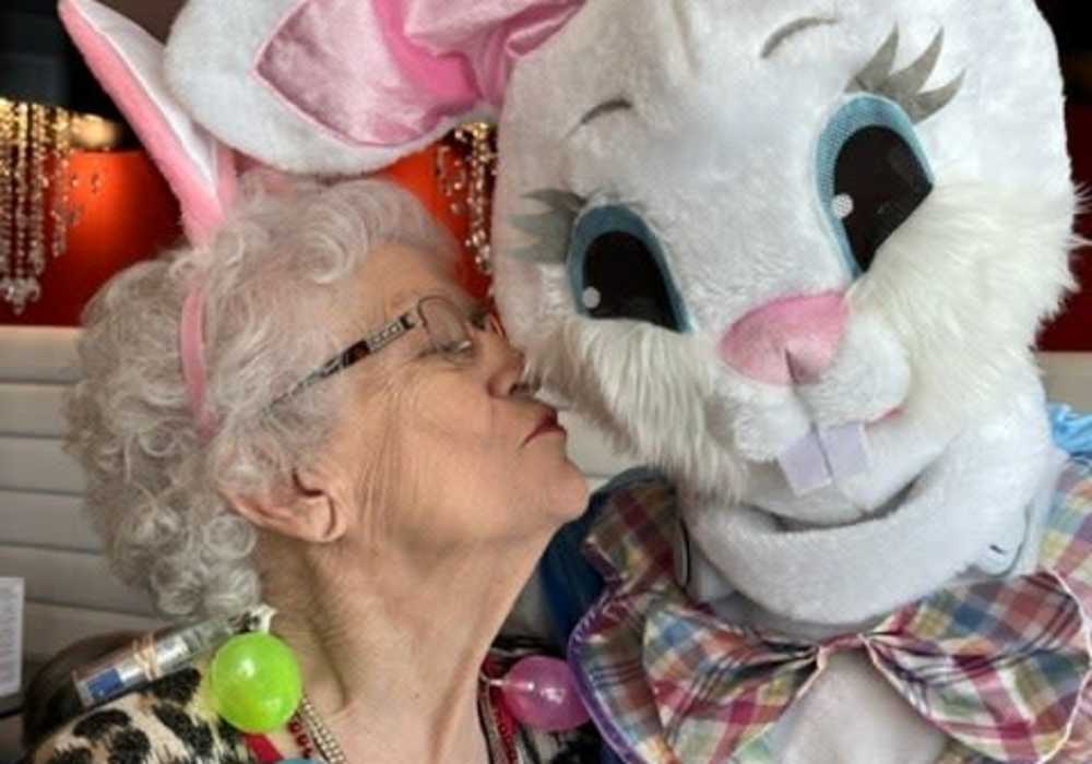Resident kissing the Easter Bunny at Turners Rock in Springfield, Missouri