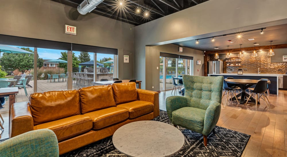 Couches and arm chairs in the community clubhouse at Huntington Apartments in Naperville, Illinois