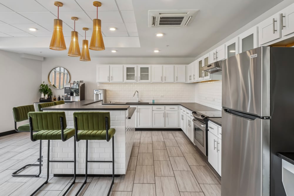 Community kitchen area with breakfast bar at Terraces at Manchester in Richmond, Virginia