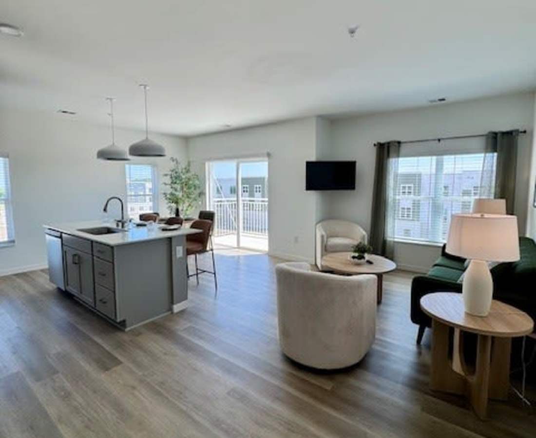 Light wood flooring with kitchen island at Pritchard Park Place in Racine, Wisconsin